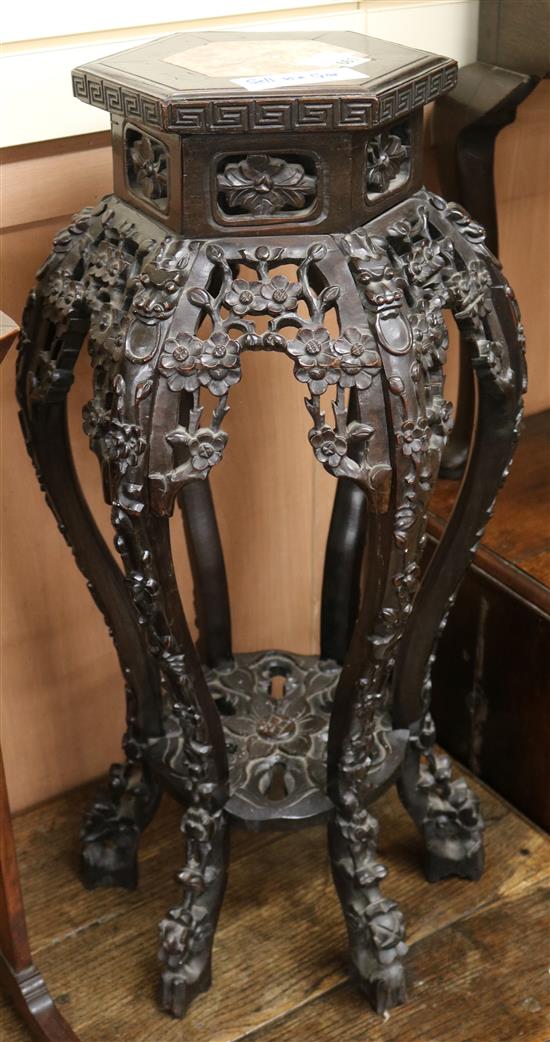 A Chinese hardwood hexagonal vase stand, with marble inset top, H.80cm